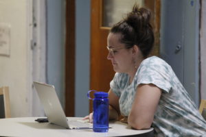 A participant in Leadership Academy works on a laptop.