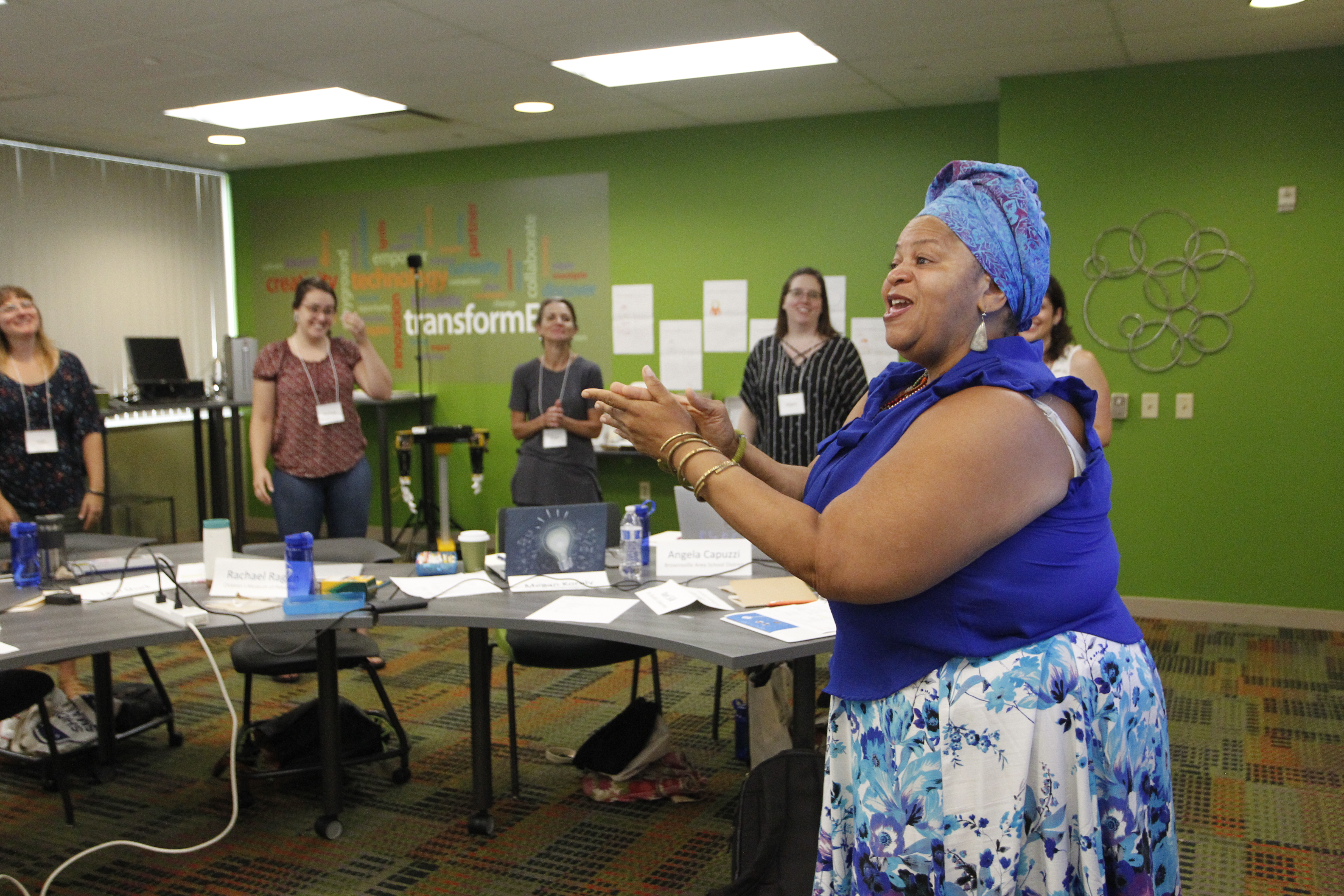 An educator leads Leadership Academy participants in a call and response.
