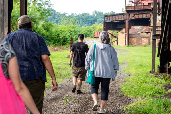 Educators walk the grounds at Carrie Blast Furnaces.
